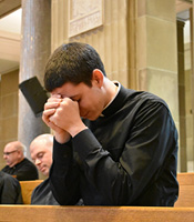 Seminarian in prayer.