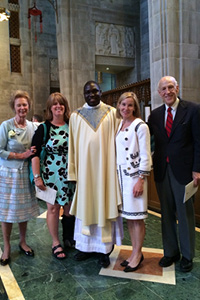 Fr. Ouma with the Obrecht family: Peggy, Charlie, Gilly, and Mary, at his priestly ordination, June 6, 2015.