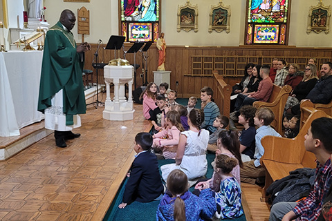 Fr. Ouma celebrating Family Mass at St. Patrick Church in Havre de Grace, February 2023.